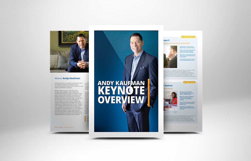 A promotional image designed by Sandra Tay for Andy Kaufman’s keynote overview, featuring him smiling in a suit on the cover, with two inside pages showing his biography and event details in the background.