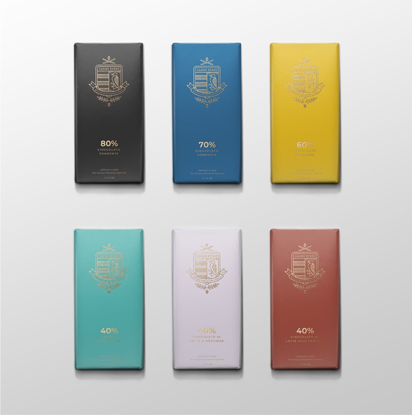 Six chocolate bars in black, blue, yellow, teal, white, and brown wrappers, each with gold-embossed designs and text indicating different cocoa percentages: 80%, 70%, 60%, 40%, 40%, and 40%.