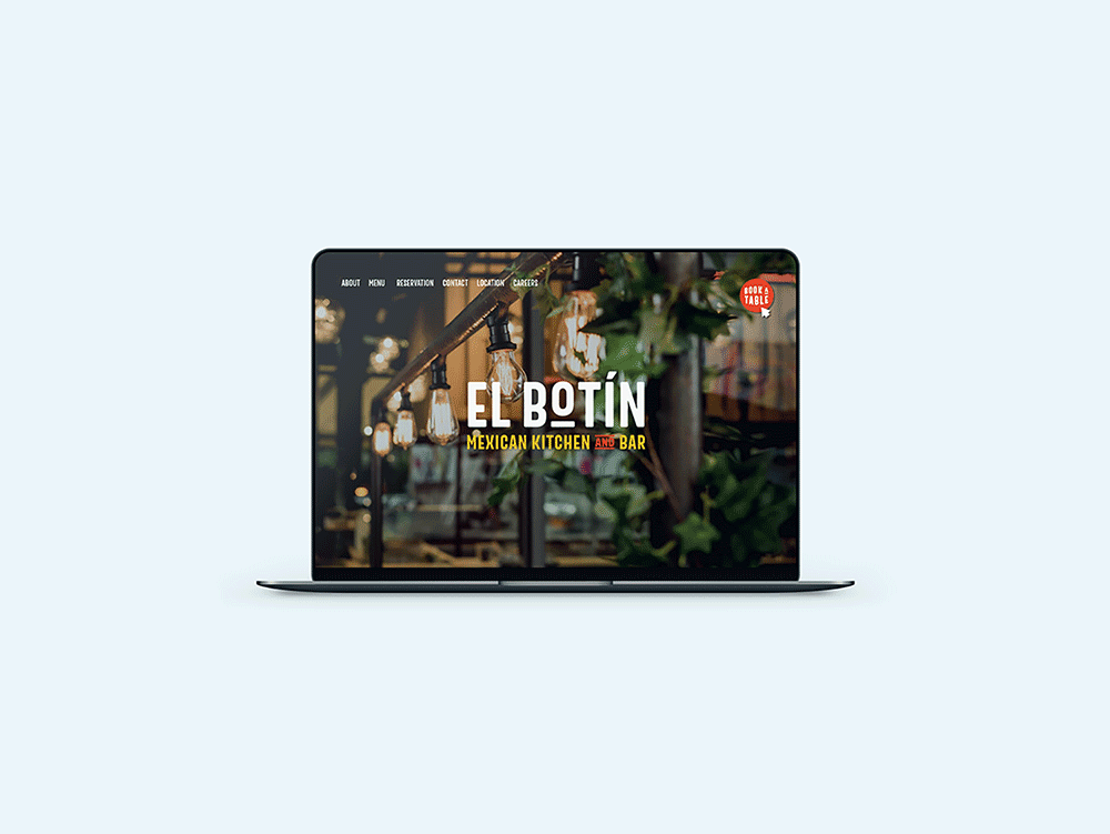 A laptop displays the homepage of El Botín Mexican Kitchen and Bar designed by Sandra Tay, featuring warm hanging lights, green plants, and navigation menu items at the top. The screen has a modern, inviting restaurant design.