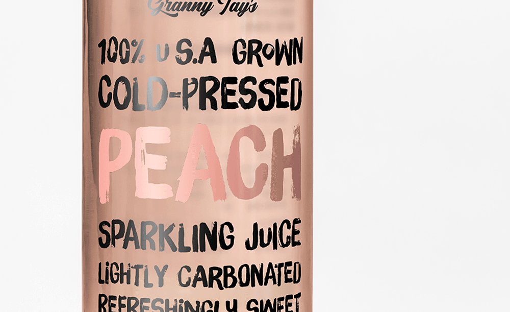 A can labeled “Granny Tay’s 100% U.S.A. Grown Cold-Pressed Peach Sparkling Juice” with text highlighting it is lightly carbonated and refreshingly sweet designed by Sandra Tay. The label uses bold, playful fonts on a peach-colored background.