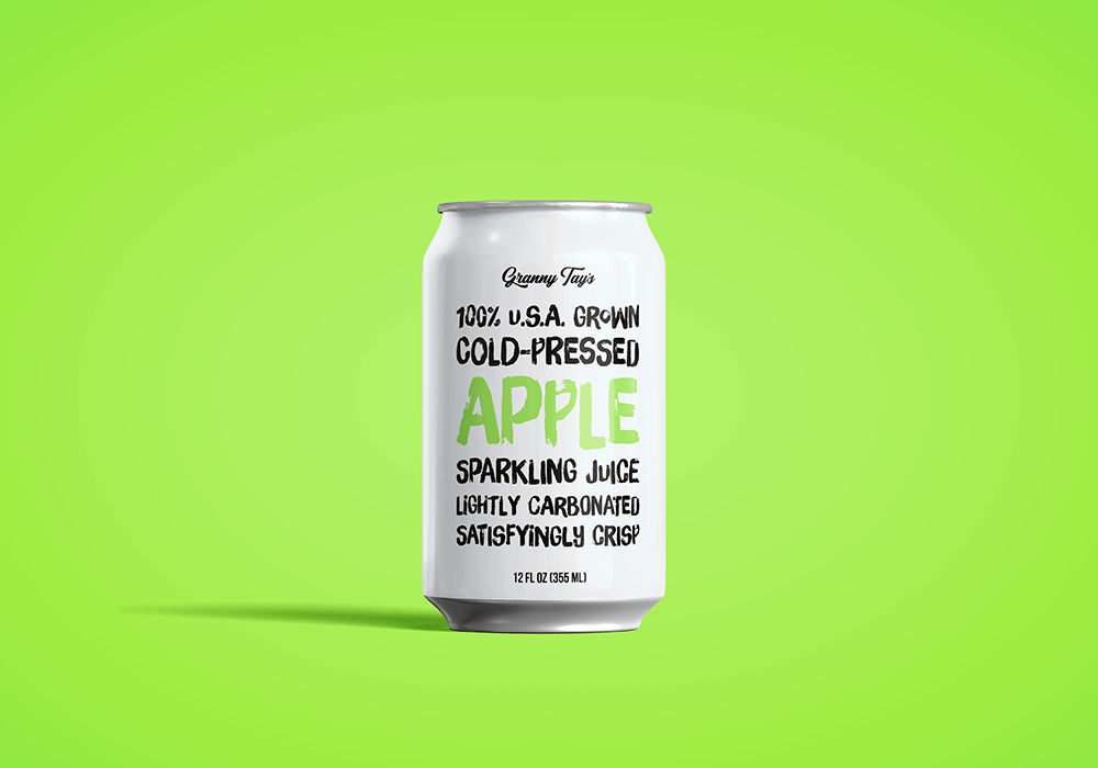 A white can of apple sparkling juice designed by Sandra Tay with bold text on the front sits on a bright green background. The label reads: 100% U.S.A. Grown Cold-Pressed Apple Sparkling Juice with additional product details below.