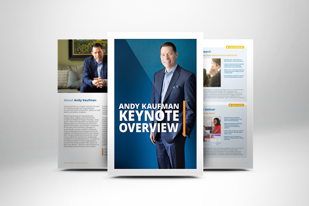 A brochure cover features a man in a suit smiling, with the text Andy Kaufman Keynote Overview. Two inner pages with text and photos are partially visible in the background.